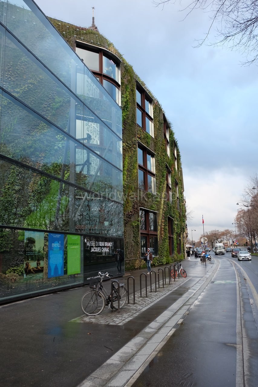 A modern building with a living green wall near the Seine in Paris