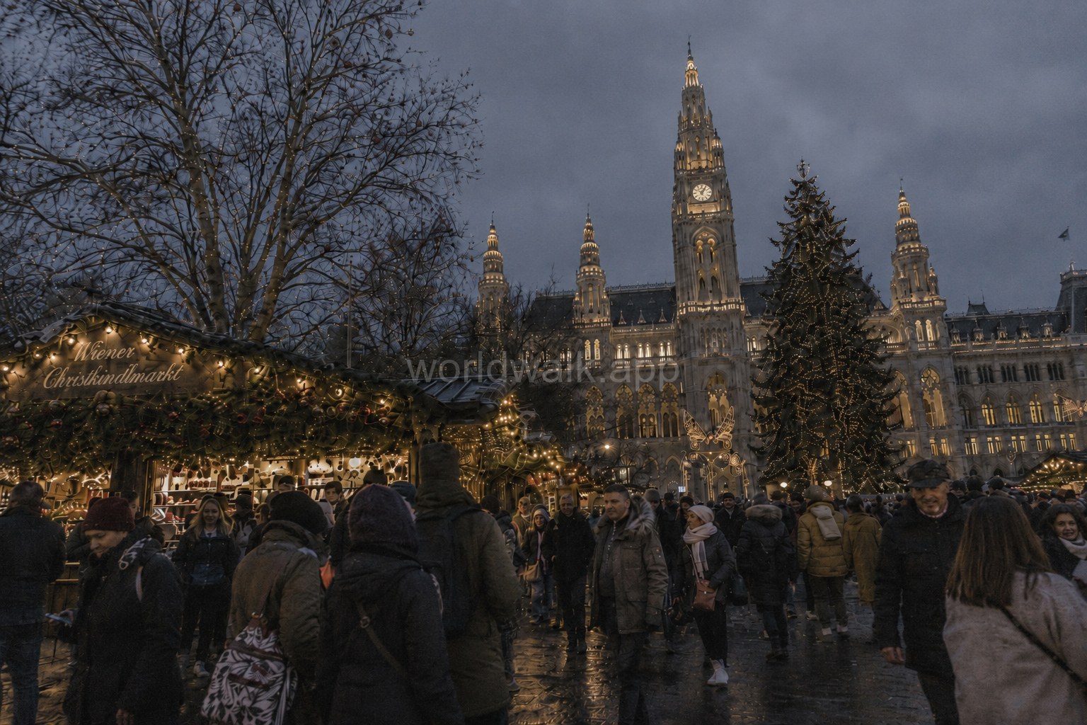 Wiener Christkindlmarkt at Rathausplatz in Vienna, lit up in the evening